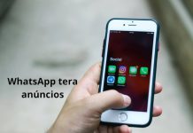 Anúncios no WhatsApp comprometem a privacidade? Entenda o que muda (e o que não muda) celular exibido com icone do whatsapp e uma frase dizendo que o whatsapp podera ter anuncio